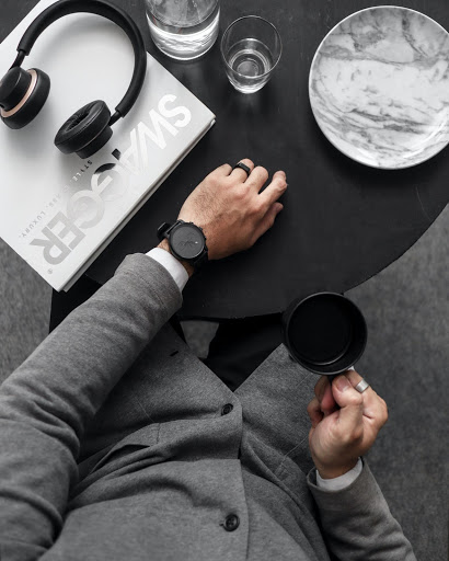man drinking on office table