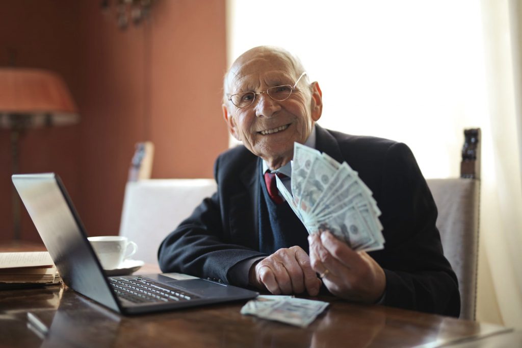 a man showing dollar bills