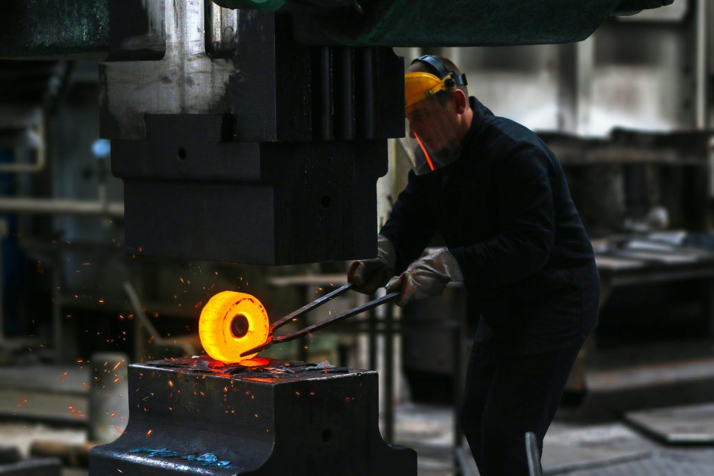 a man working on a glass blower