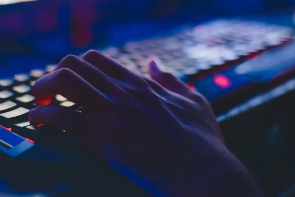 a person's hand is on the keyboards