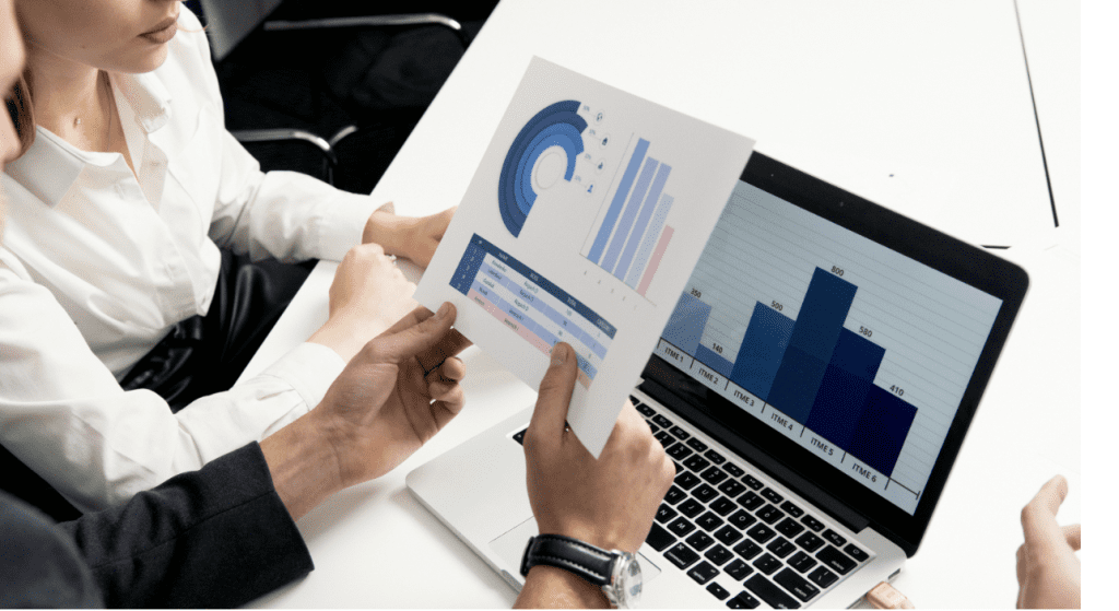 business people looking at graph